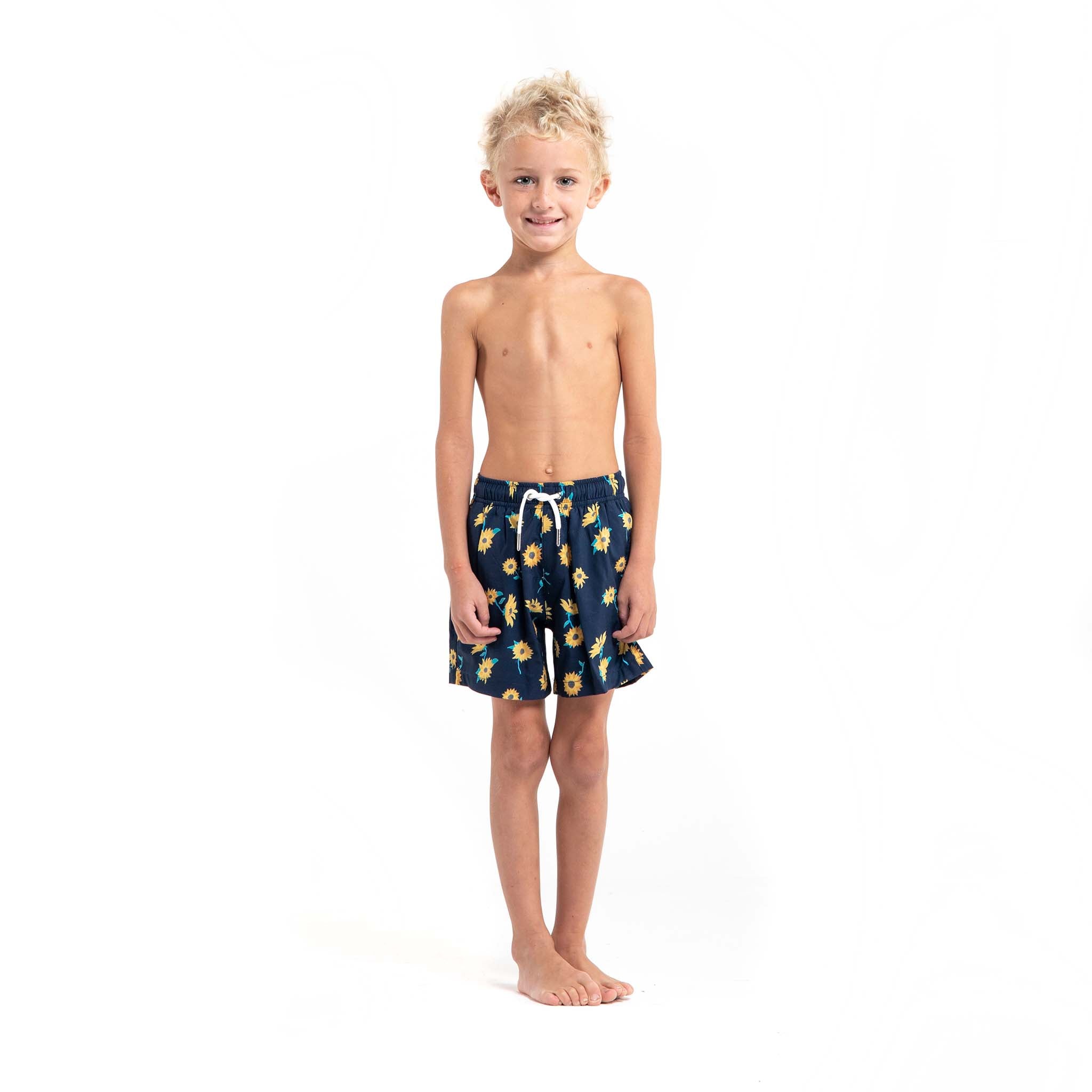 Bright and colorful Sunflower Kids swim trunks made from recycled materials, featuring a stretchy mesh liner and multiple pockets.