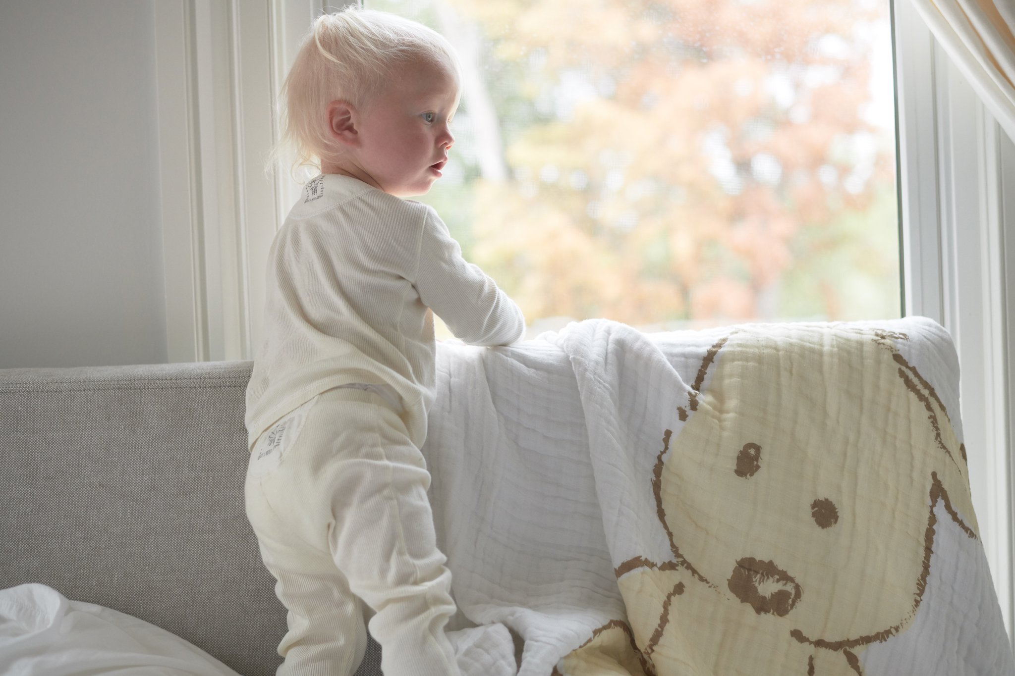 Teddy Bear and Plaid Cotton Muslin Newcastle Blanket featuring a soft, cozy design with a playful teddy bear pattern.