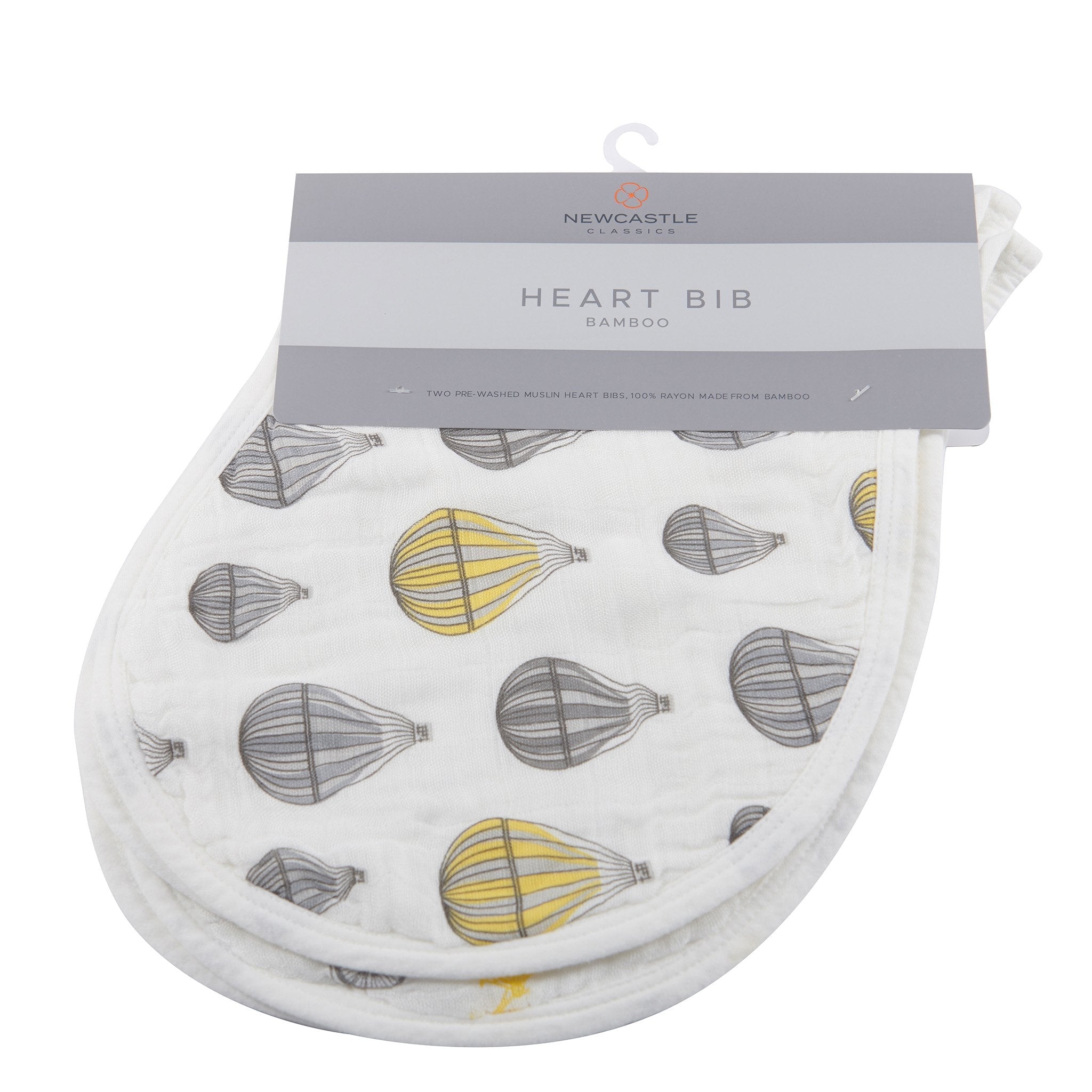 Two stylish Traveler Bamboo Heart Bibs made from soft, absorbent bamboo muslin, featuring multiple snaps for adjustable fit.