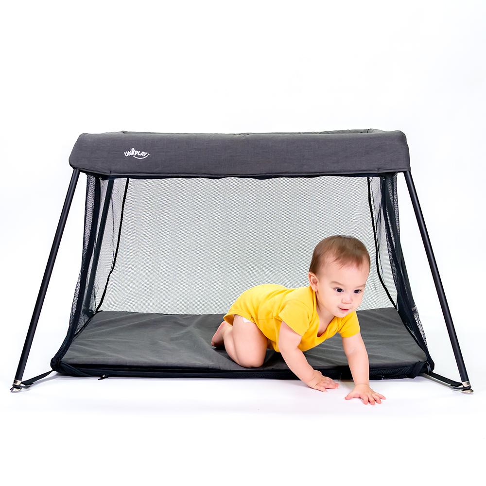 UNiPLAY Portable Playard showcasing its lightweight design and sturdy frame, perfect for travel and easy assembly.