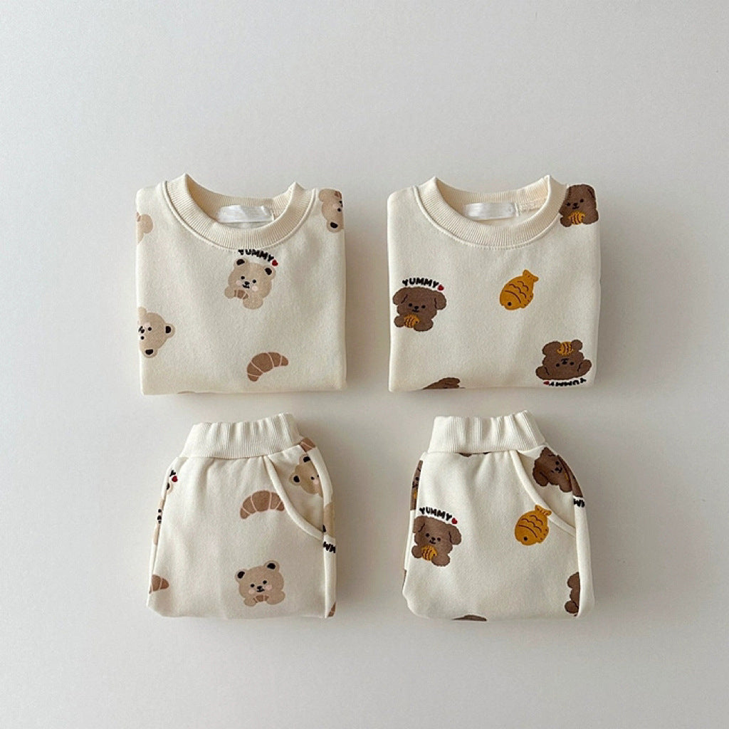 Unisex baby and kids apricot animals cartoon top and pants set in beige and apricot colors, featuring playful animal designs.