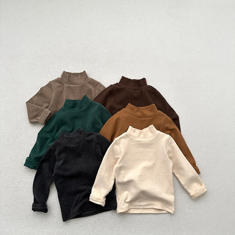 Unisex Baby Kids Stretch Solid Long Sleeve Sweatshirt in various colors, showcasing its soft fabric and versatile design.