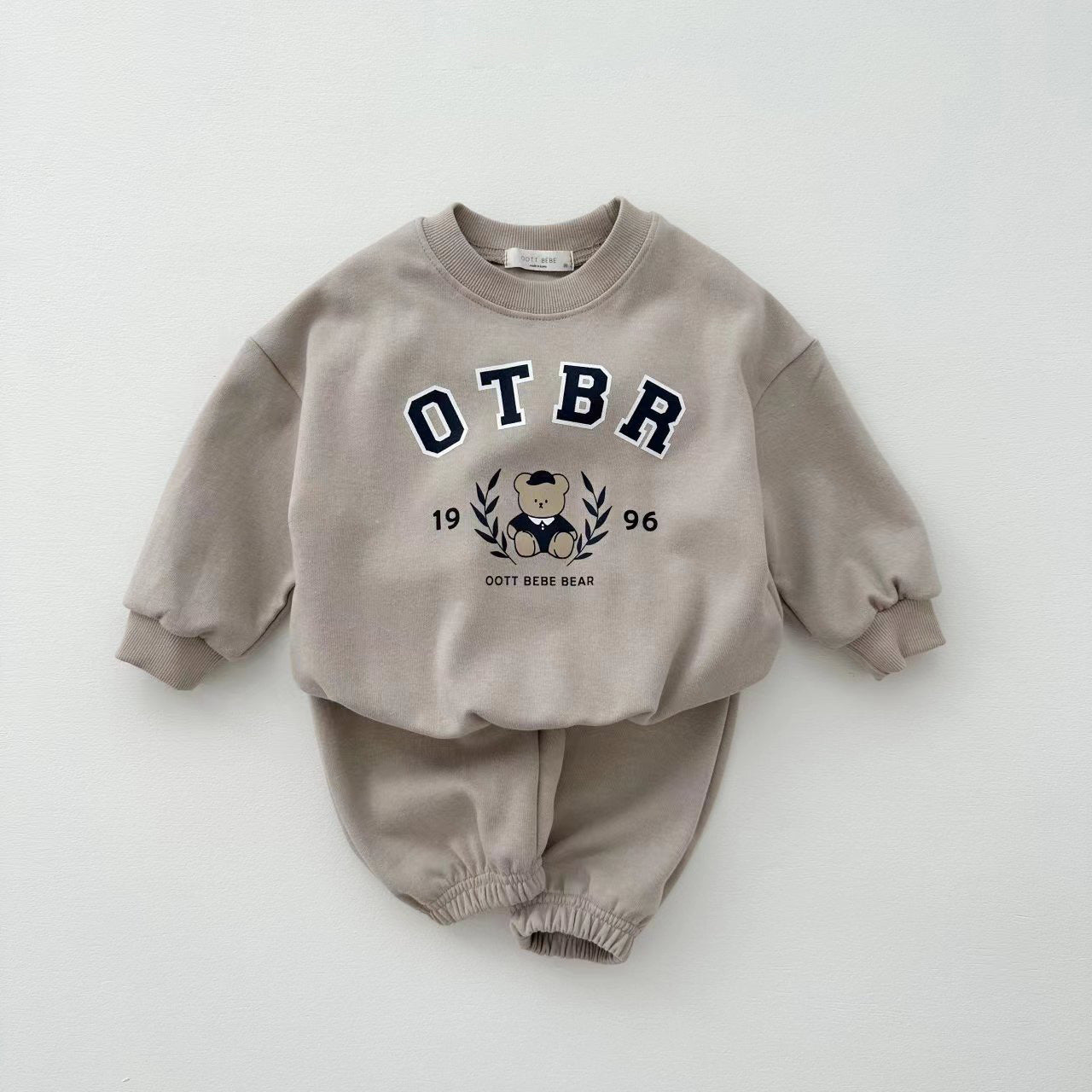 Unisex Baby Letter Print Combo featuring a cartoon pattern top and long pants in pink, grey, and apricot colors, perfect for baby girls.