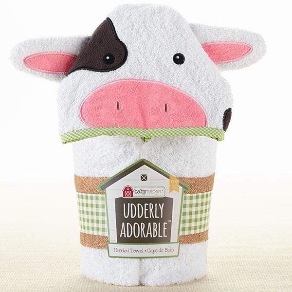 A soft white terry hooded towel featuring a smiling cow's face with 3-D ears, pink nose, and black spots, perfect for babies aged 0-9 months.