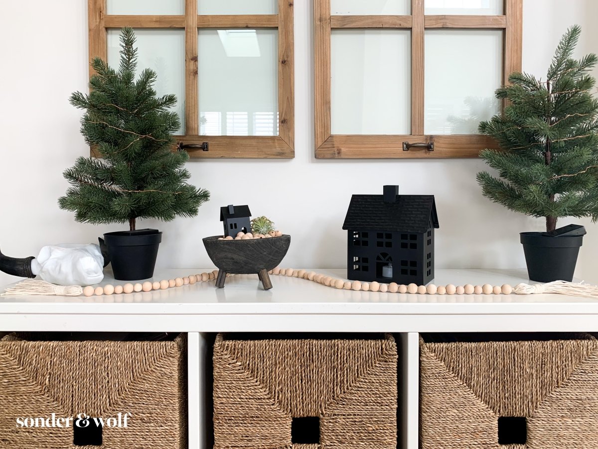 Handmade variated wood bead garland featuring cotton tassels, perfect for home decor.