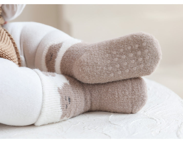 Winter Baby Unisex Breathable Comfy Cartoon Antiskid Socks in various colors with cartoon patterns, designed for comfort and safety.