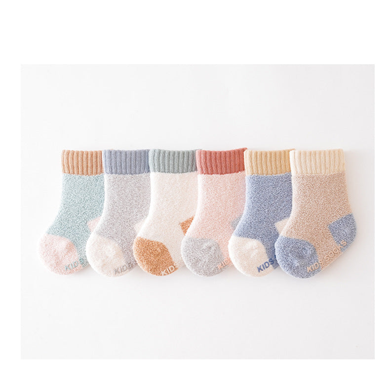 Winter Baby Unisex Breathable Comfy Patchwork Antiskid Socks in various colors, showcasing their soft texture and antiskid soles.