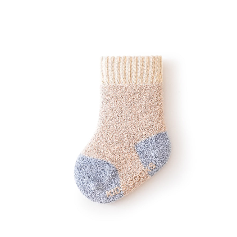 Winter Baby Unisex Breathable Comfy Patchwork Antiskid Socks in various colors, showcasing their soft texture and antiskid soles.