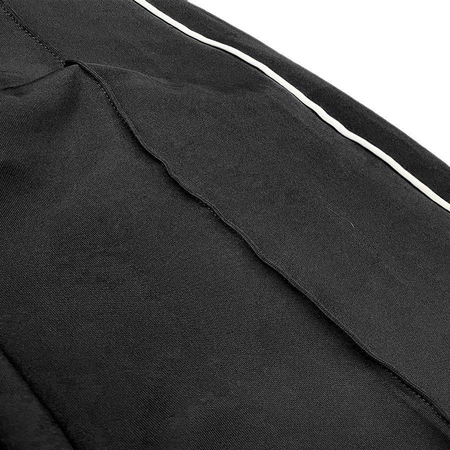 Men's Side Pipe Stacked Flare Pants featuring white side piping and zippered pockets, perfect for casual wear.