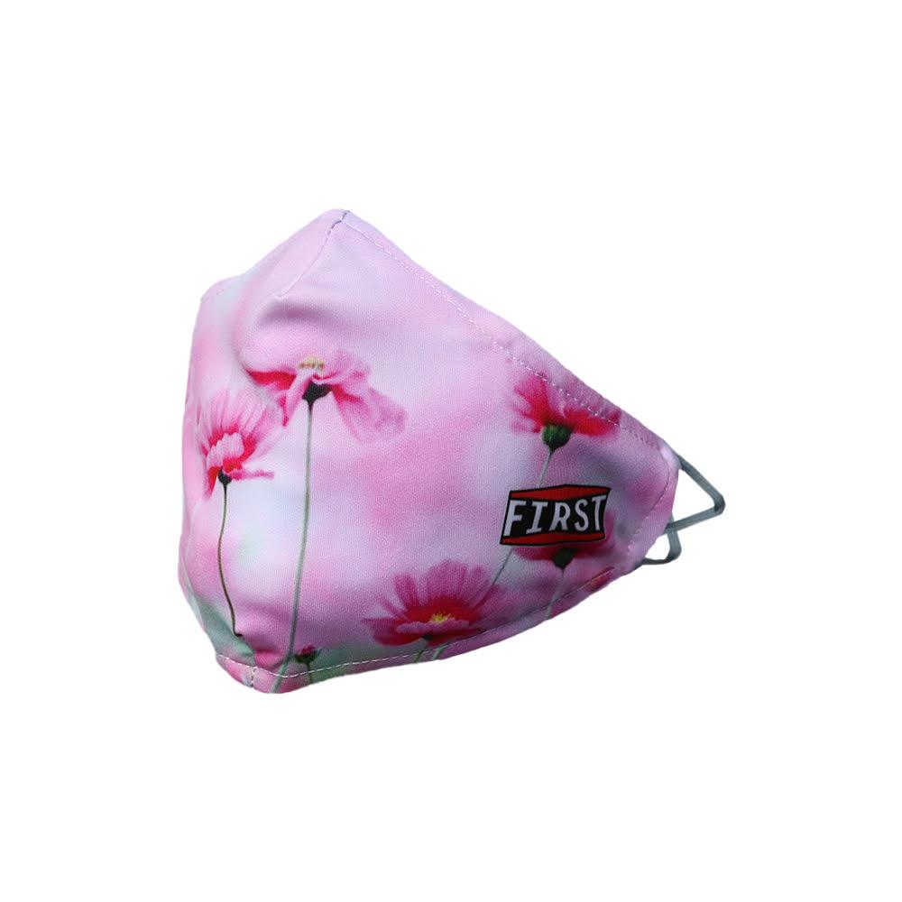 A set of 5 reusable 2-ply pink floral masks with elastic ear bands, showcasing their stylish design and breathable fabric.
