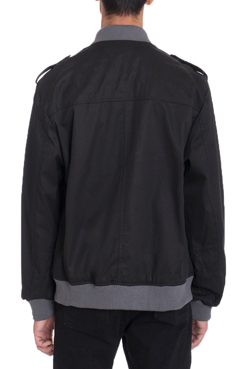 A stylish cotton windbreaker in a regular fit, featuring button trims on the shoulders and a water-resistant finish, perfect for casual wear.