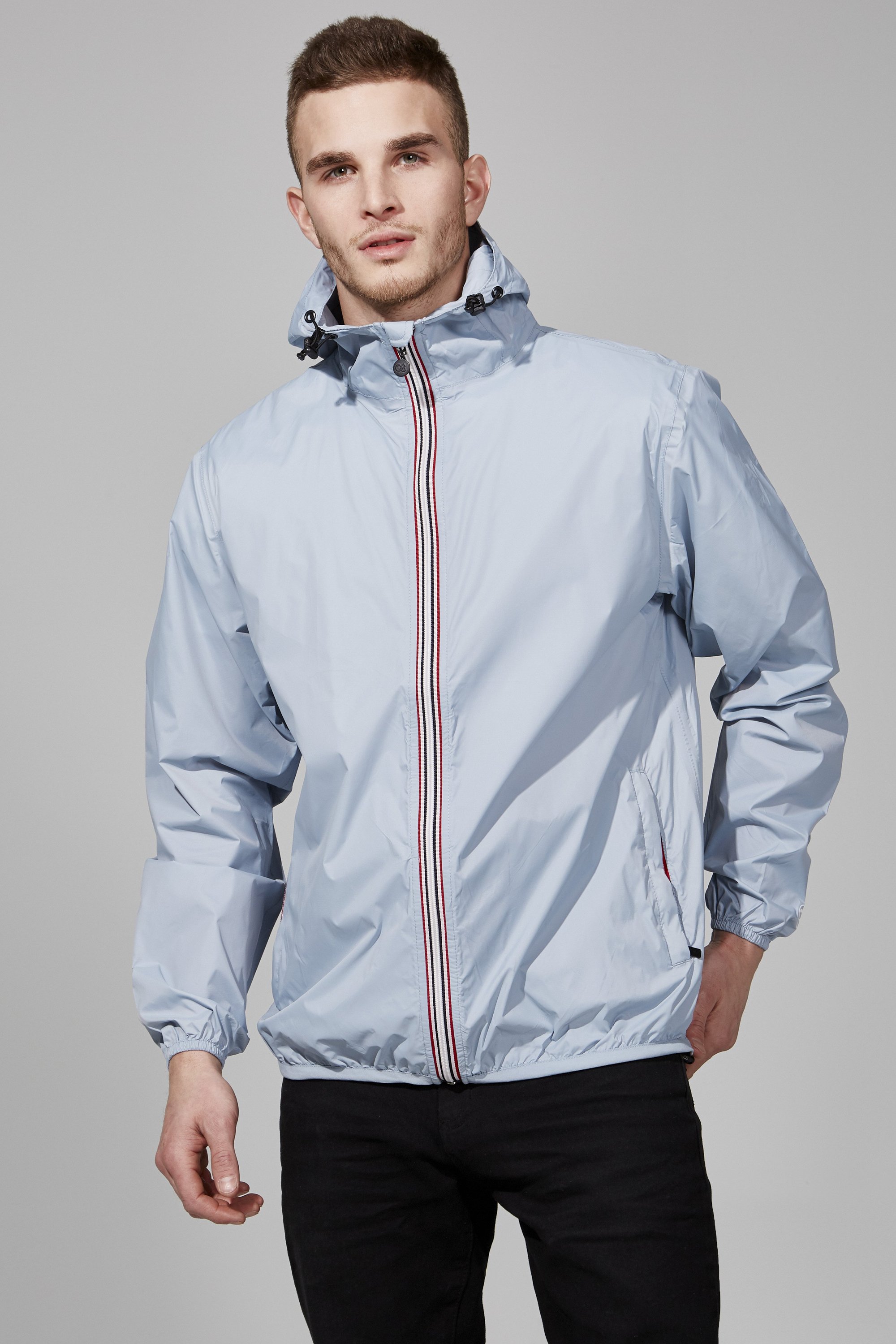 Celestial blue full zip packable rain jacket, showcasing its waterproof fabric and compact design.