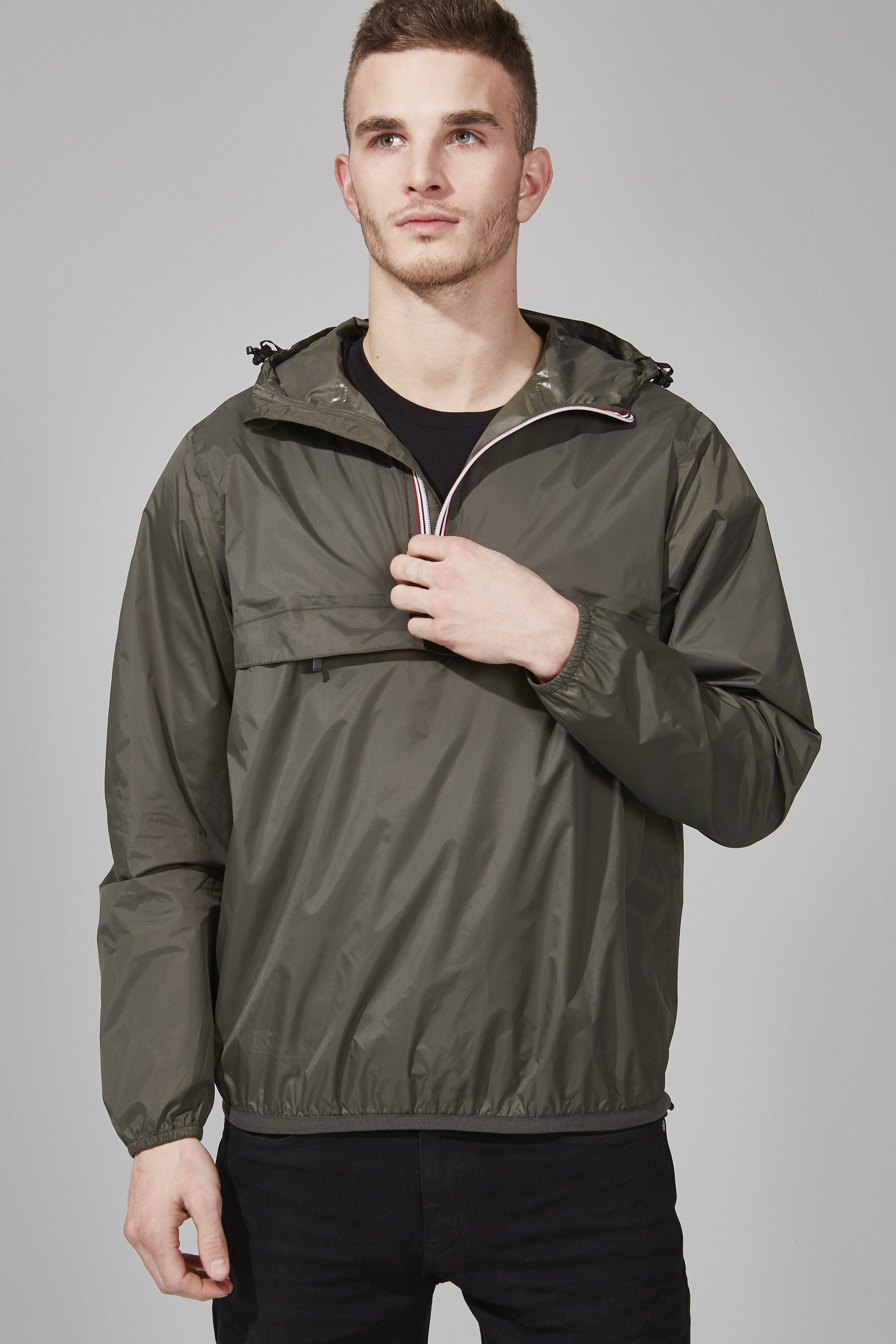 Men's Torba Quarter Zip Packable Rain Jacket in a stylish design, showcasing its waterproof fabric and packable feature.