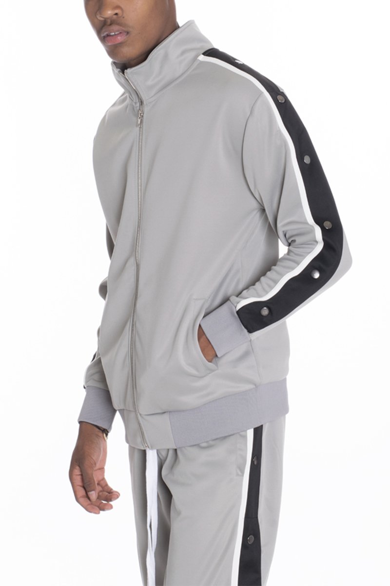 Grey snap button track jacket featuring snap closures on sleeves and two front welt pockets, designed for a regular fit.