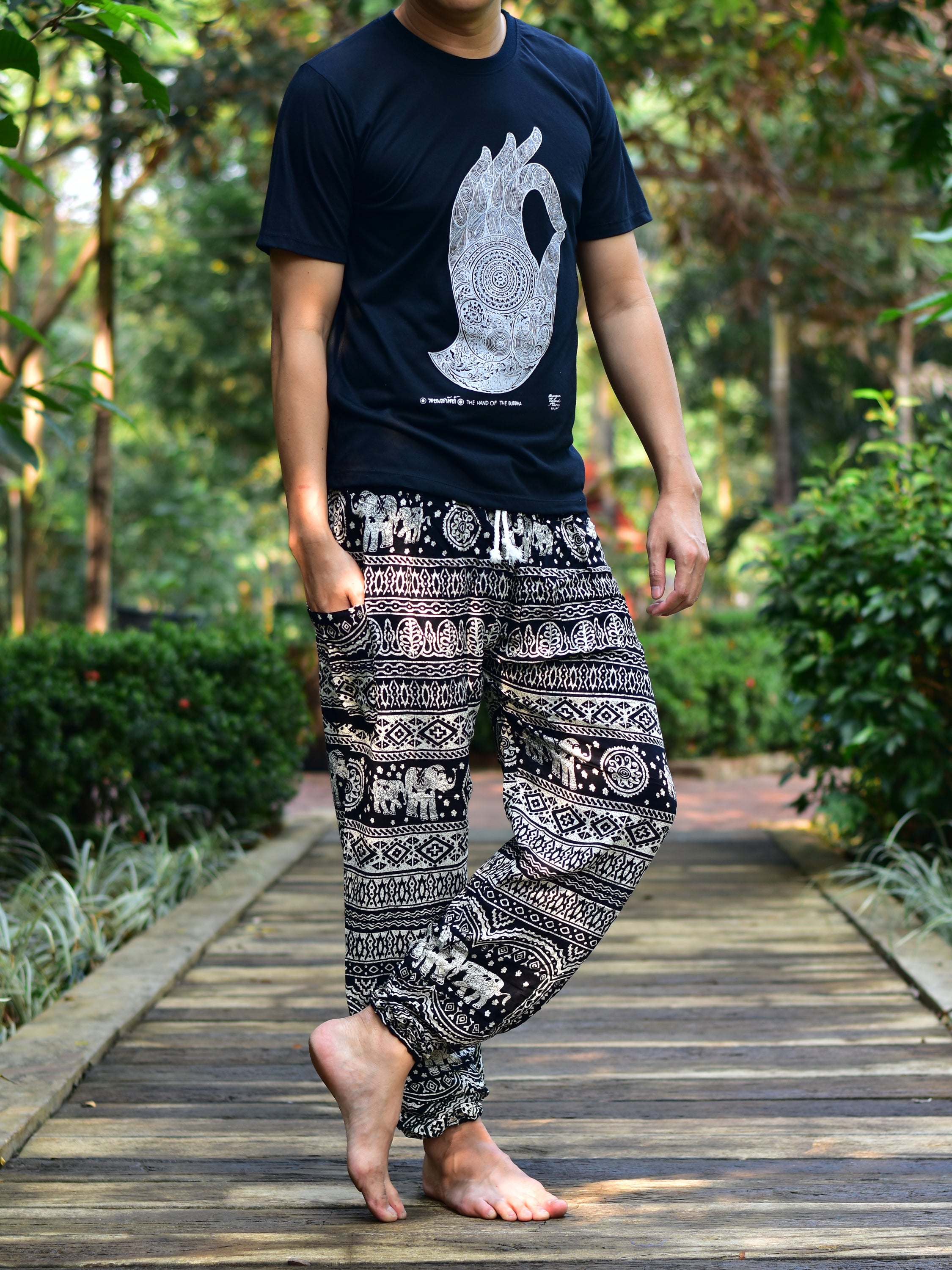 Bohotusk Men's Black Elephant Calf Harem Pants showcasing a stylish design with elasticated waist and ankles, made from soft rayon material.