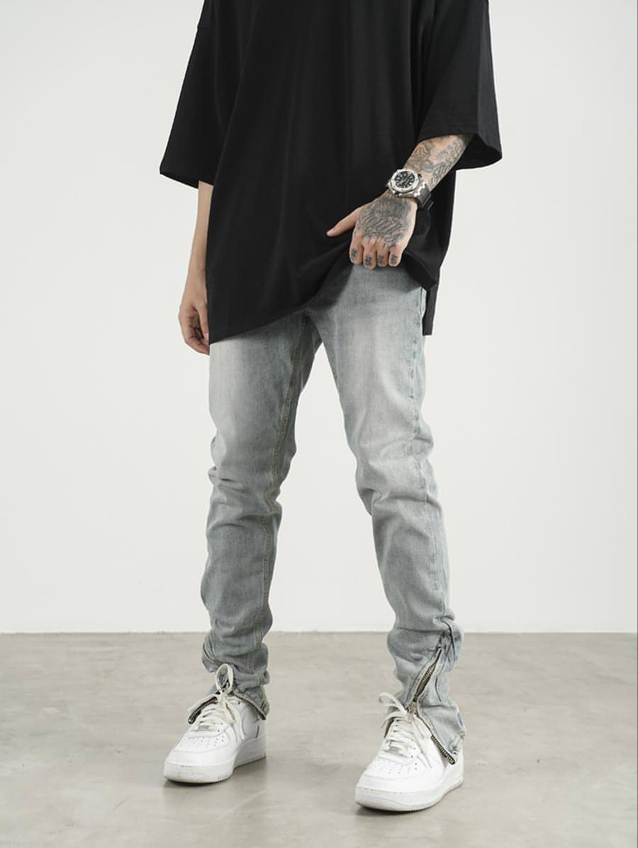 Men's High Street Zipper Split Slim Jeans featuring trendy zipper and split details for a modern look.