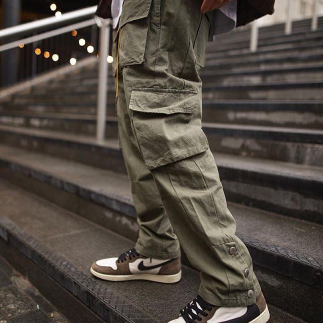 Multi-Pocket Casual Cargos in green, black, and khaki colors, showcasing multiple pockets and a loose fit design for men.