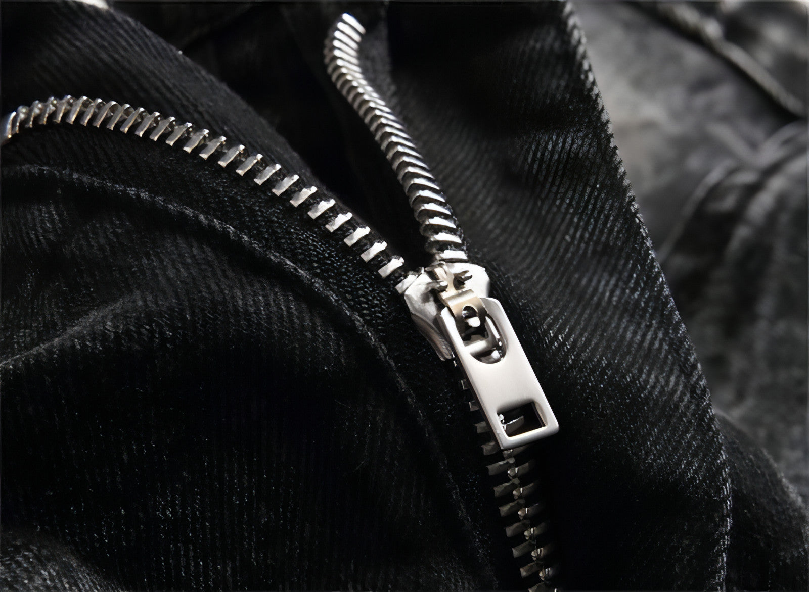 Punk men's jeans featuring unique hole embroidery and five-pointed star detailing, showcasing a rebellious style.