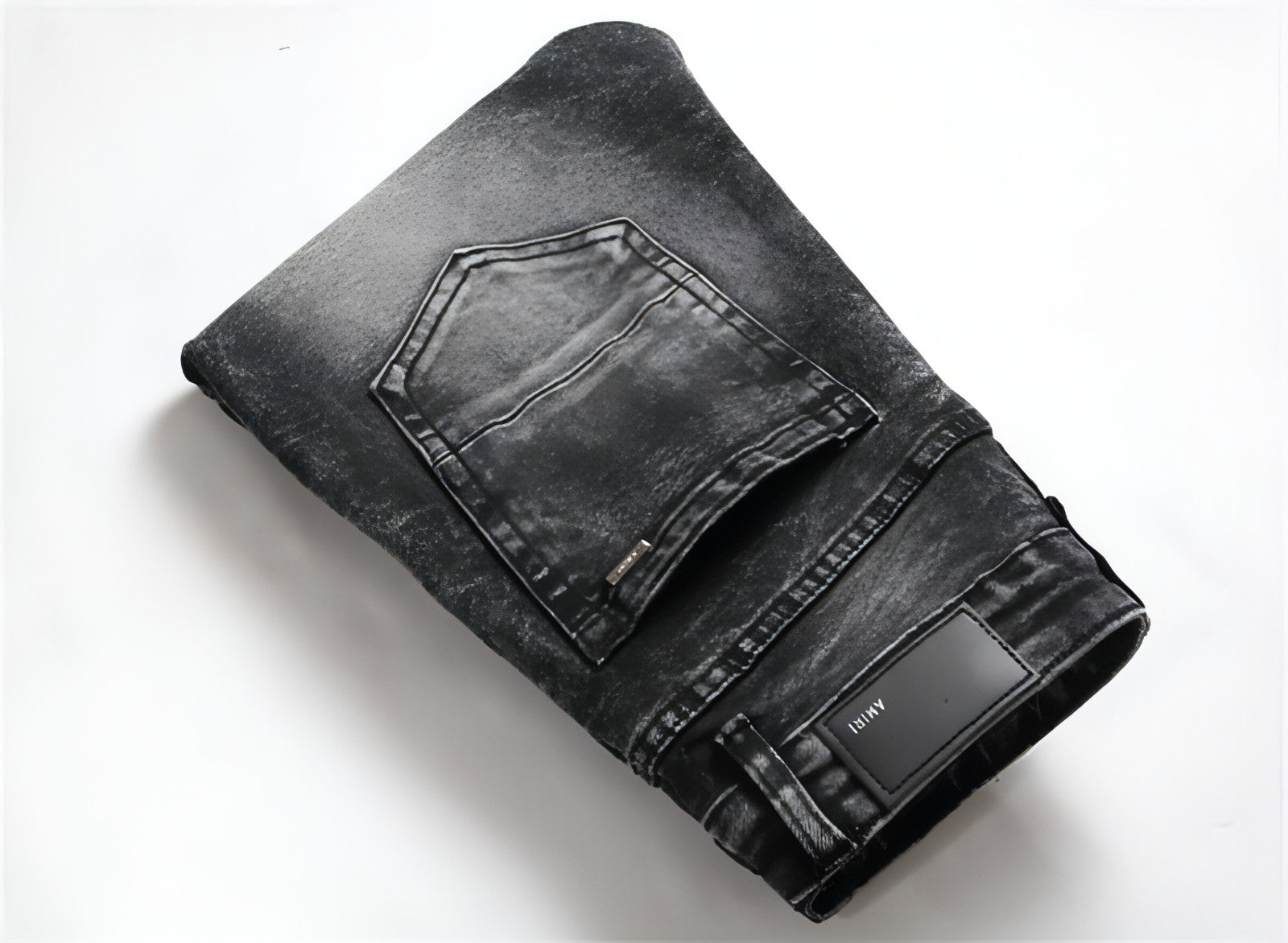 Punk men's jeans featuring unique hole embroidery and five-pointed star detailing, showcasing a rebellious style.