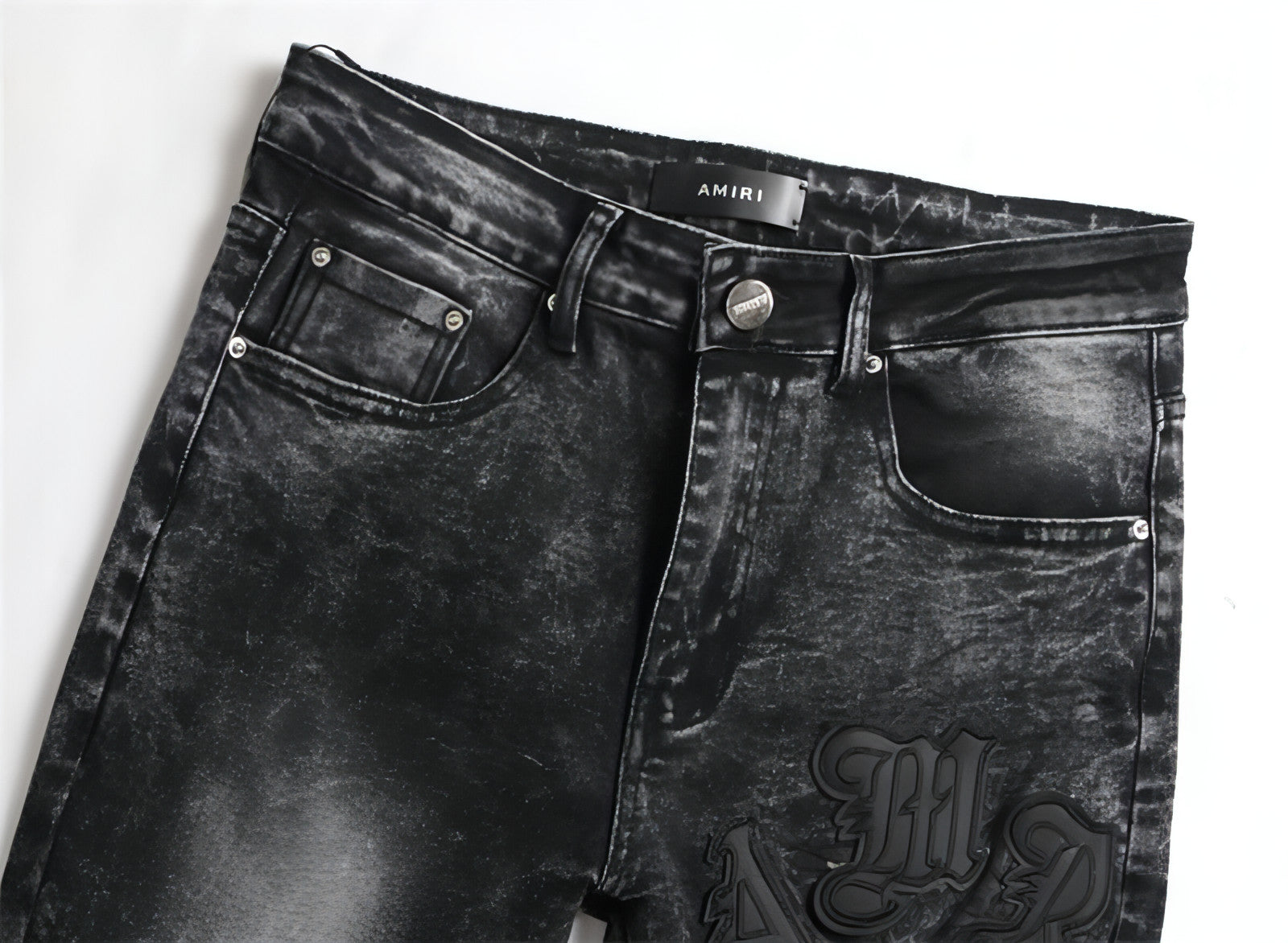 Punk men's jeans featuring unique hole embroidery and five-pointed star detailing, showcasing a rebellious style.