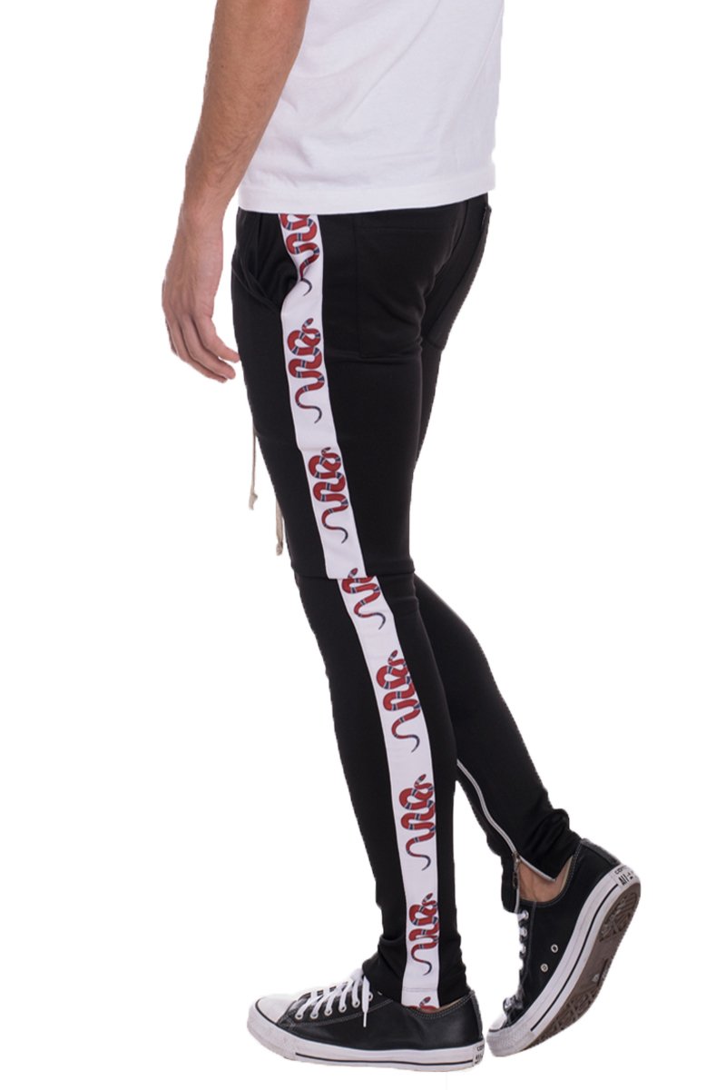 A pair of stylish SNAKE TRACK PANTS featuring a skinny fit, elastic waist with drawstring, and standard pocket, perfect for casual or sporty wear.