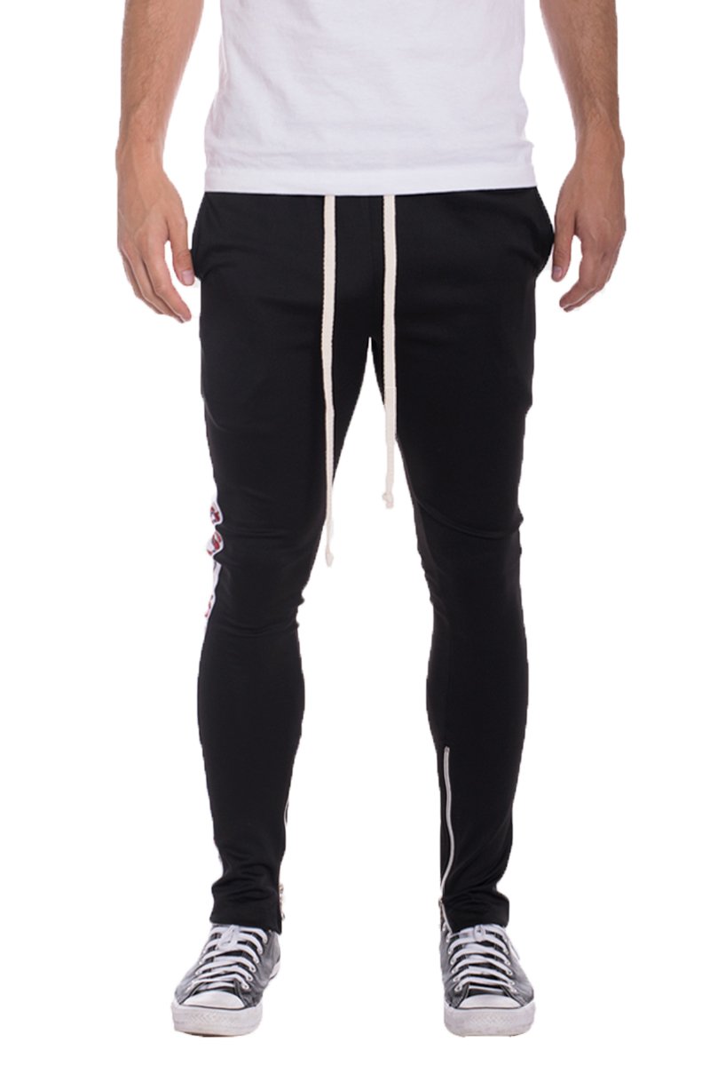 A pair of stylish SNAKE TRACK PANTS featuring a skinny fit, elastic waist with drawstring, and standard pocket, perfect for casual or sporty wear.