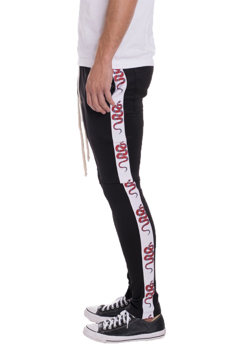 A pair of stylish SNAKE TRACK PANTS featuring a skinny fit, elastic waist with drawstring, and standard pocket, perfect for casual or sporty wear.