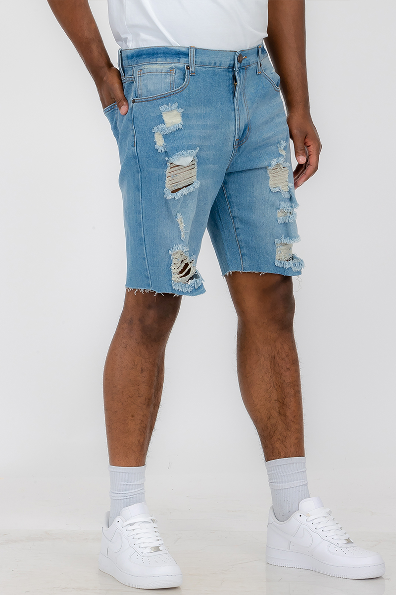 Men's distressed denim shorts featuring a button closure waist and standard pockets, styled above the knee for a trendy summer look.