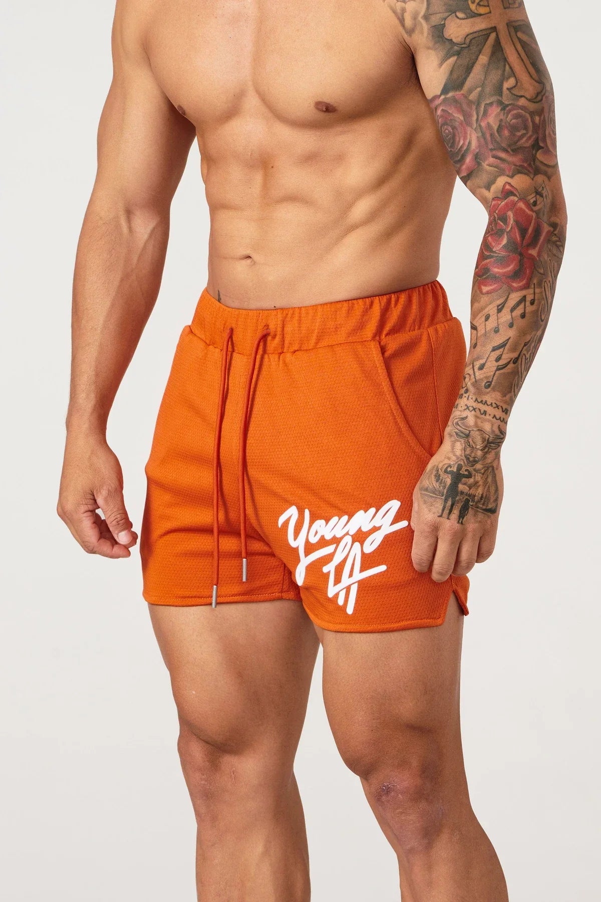 Young LA Trendy Beach Shorts for men featuring vibrant prints and elastic waist for comfort, perfect for summer activities.