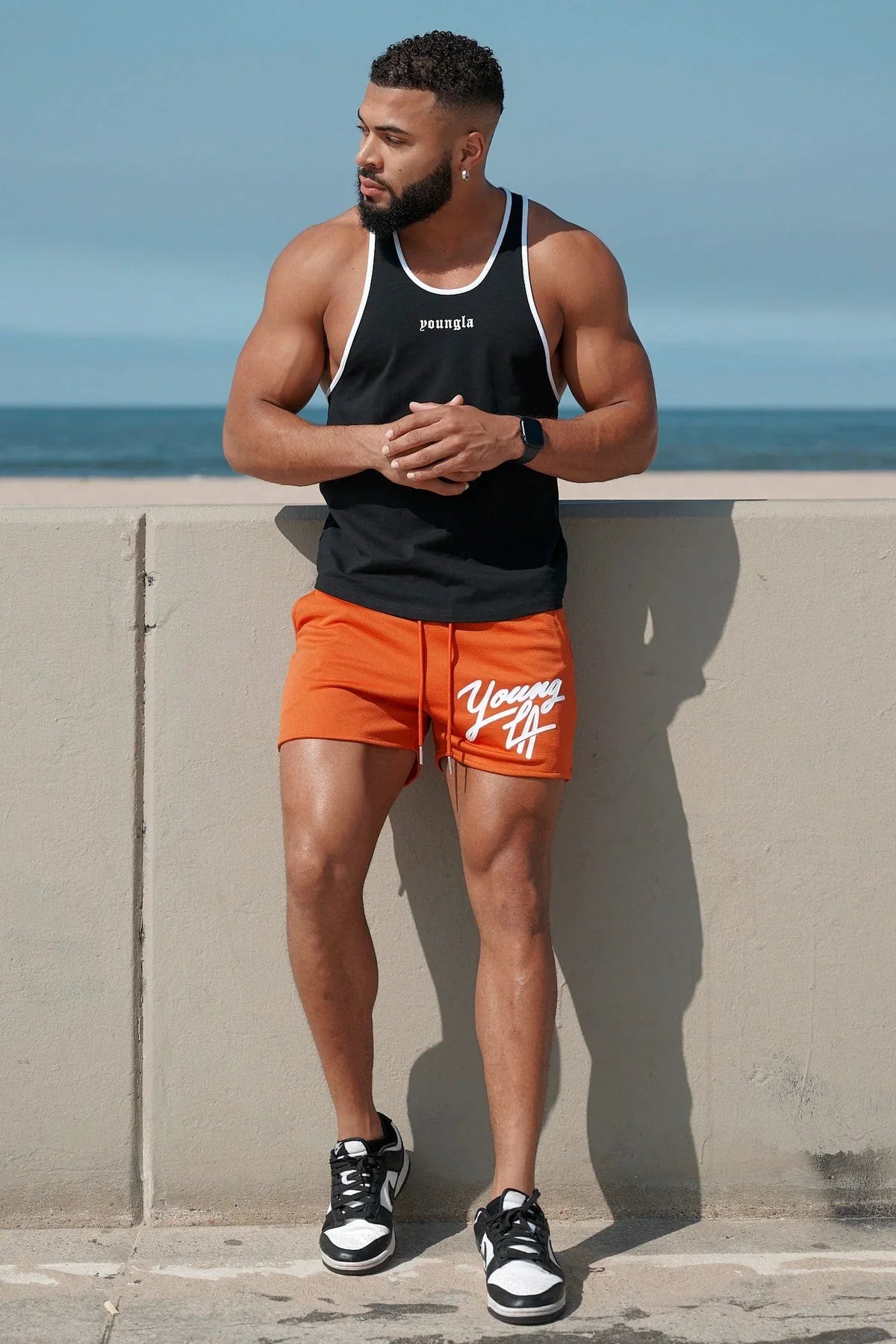 Young LA Trendy Beach Shorts for men featuring vibrant prints and elastic waist for comfort, perfect for summer activities.
