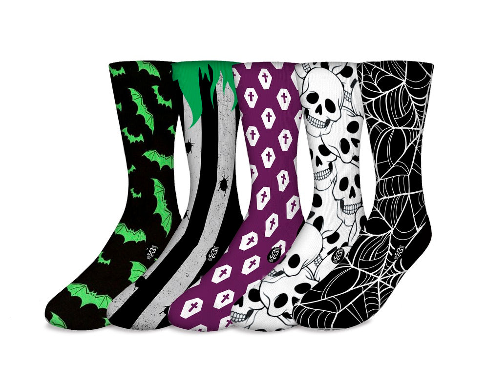 A colorful assortment of five Halloween-themed socks featuring pumpkins, ghosts, and spooky designs, perfect for festive occasions.