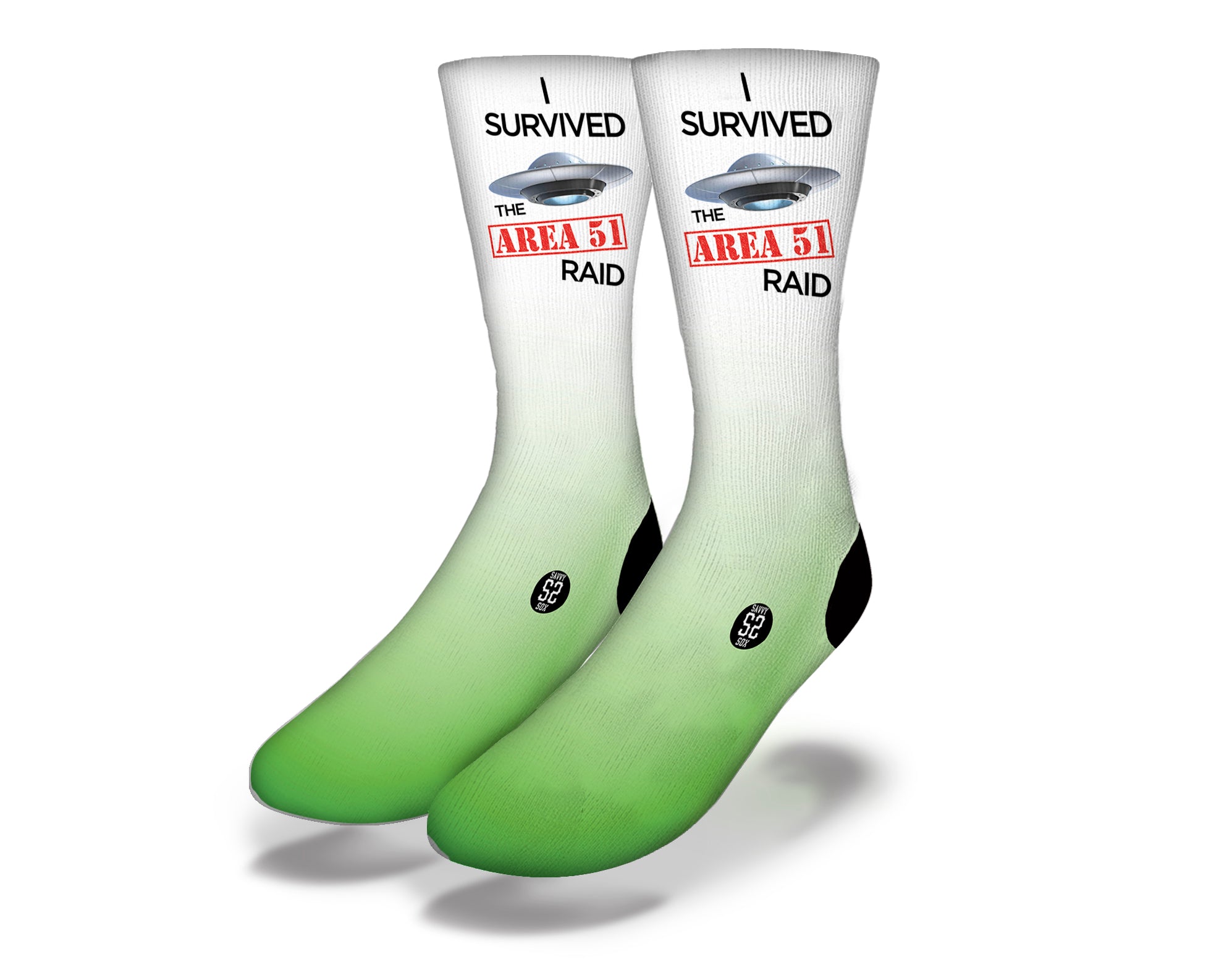 A pair of colorful socks featuring alien and UFO designs, representing the I Survived Area 51 theme.
