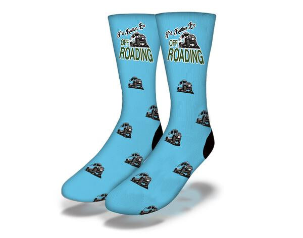 A vibrant blue t-shirt with the phrase 'I'd Rather Be Off Roading' printed on it, perfect for outdoor enthusiasts.