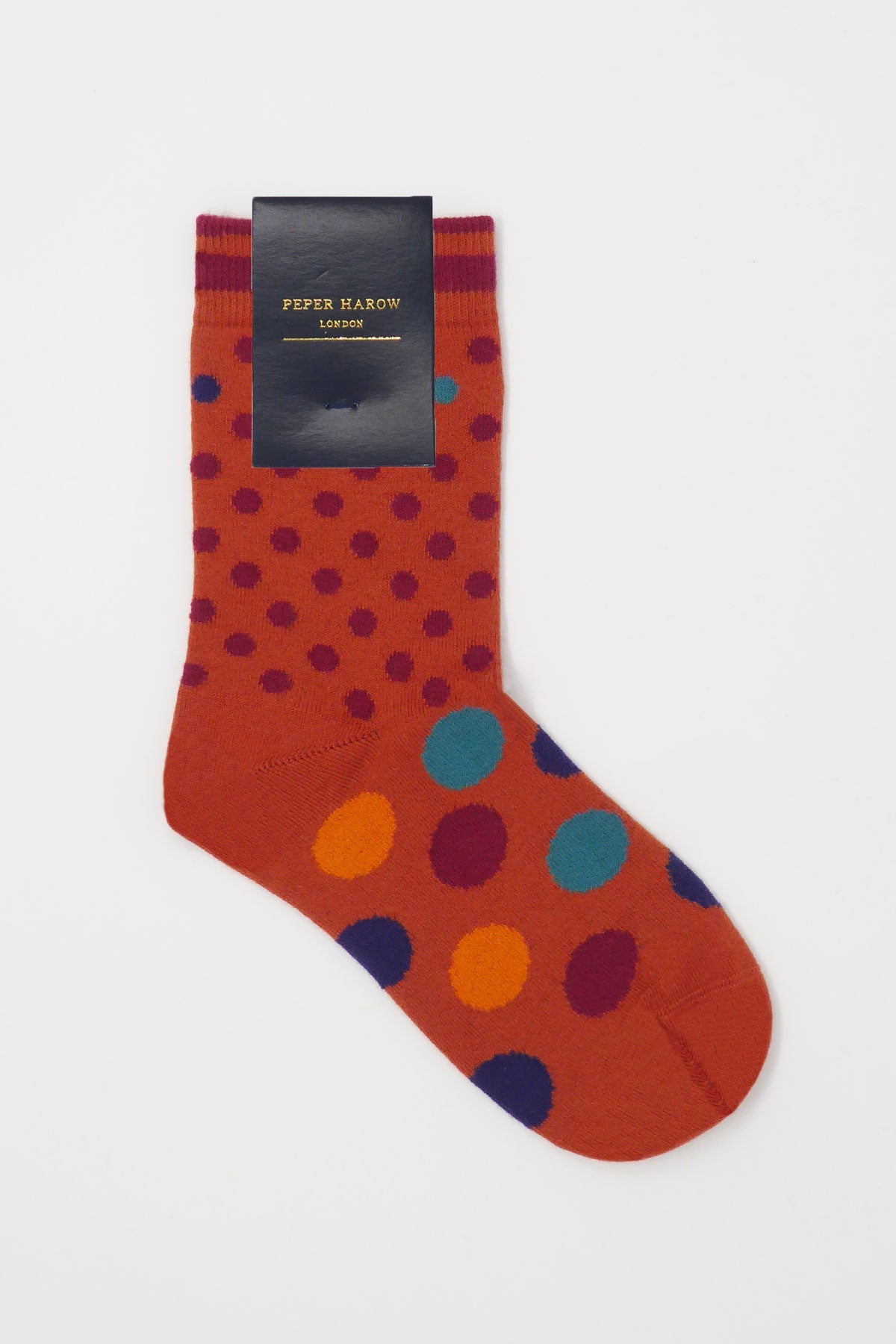 Terracotta Mary women's socks featuring vibrant polka dots in wine, orange, navy, and blue.