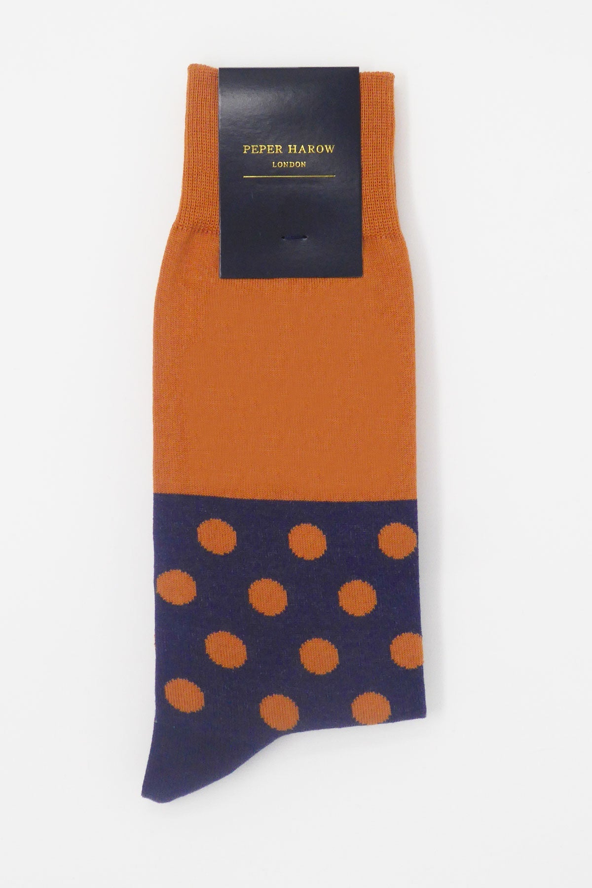 Mayfair Men's Socks in burnt orange with navy polka dots and grey-yellow sole, showcasing luxury and style.