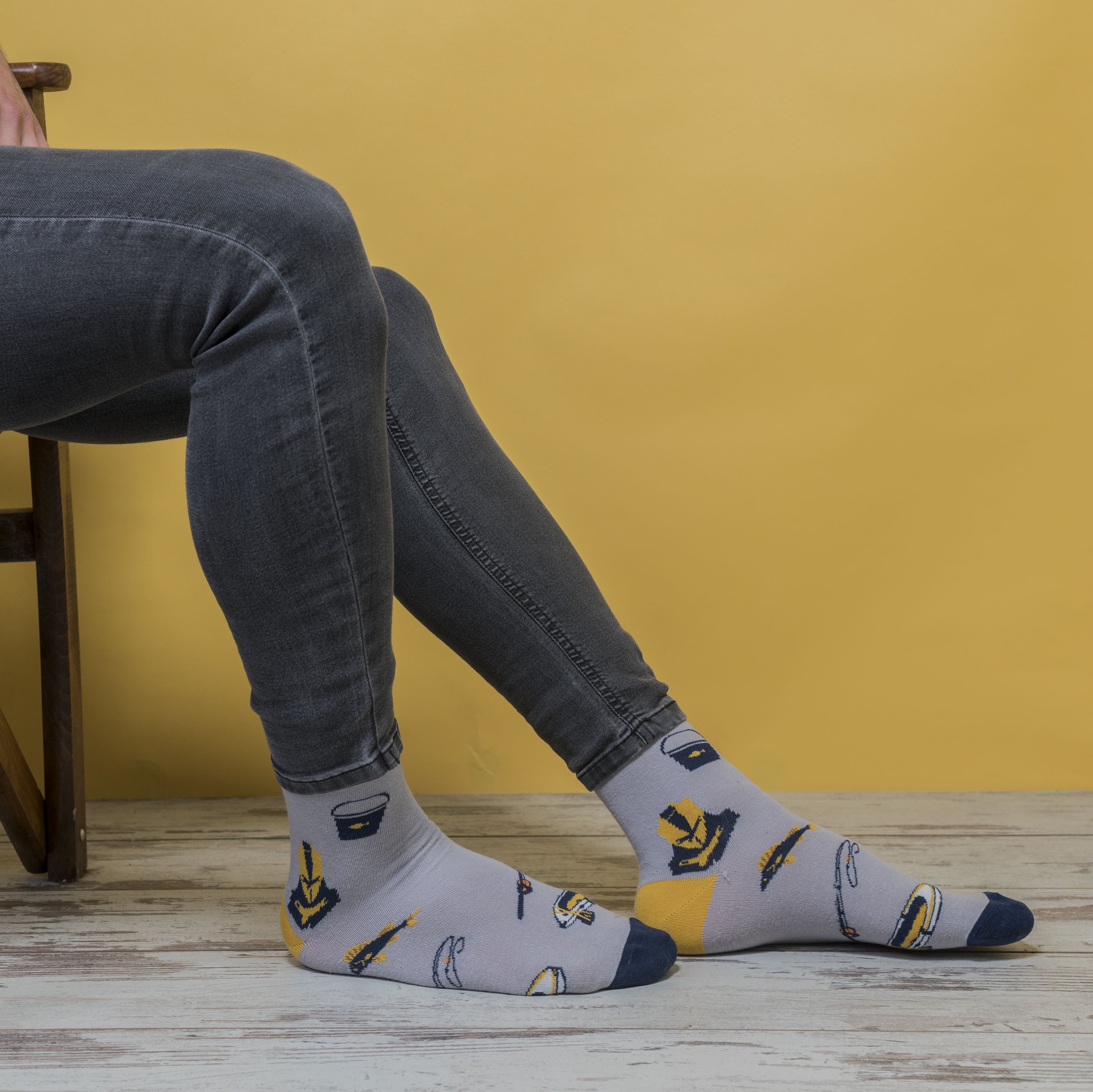 A pair of colorful men's fishing socks made from soft Turkish cotton, featuring trendy patterns and a comfortable fit.