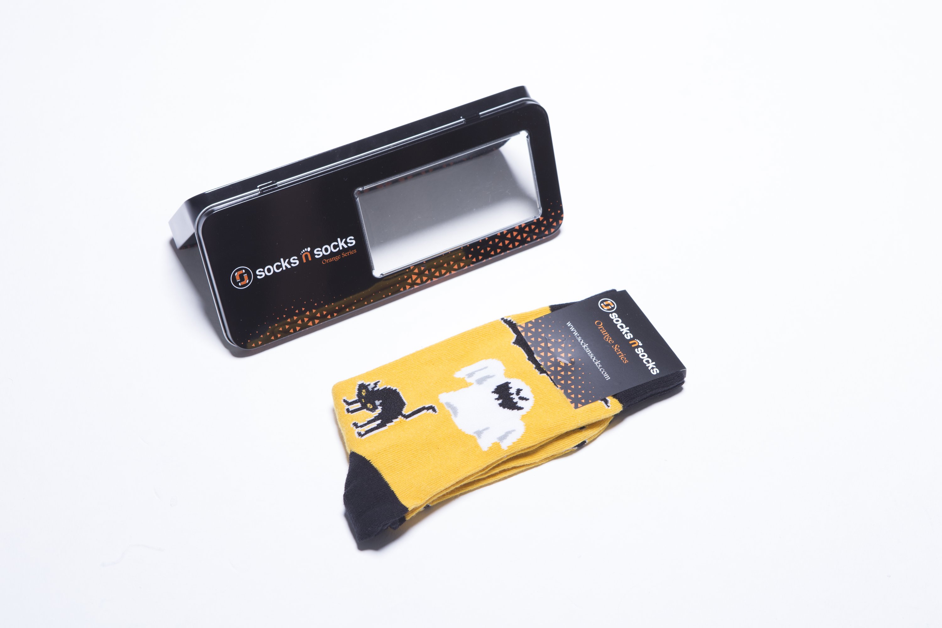 Men's Halloween Spirit Socks featuring festive designs, made from soft combed cotton blend.