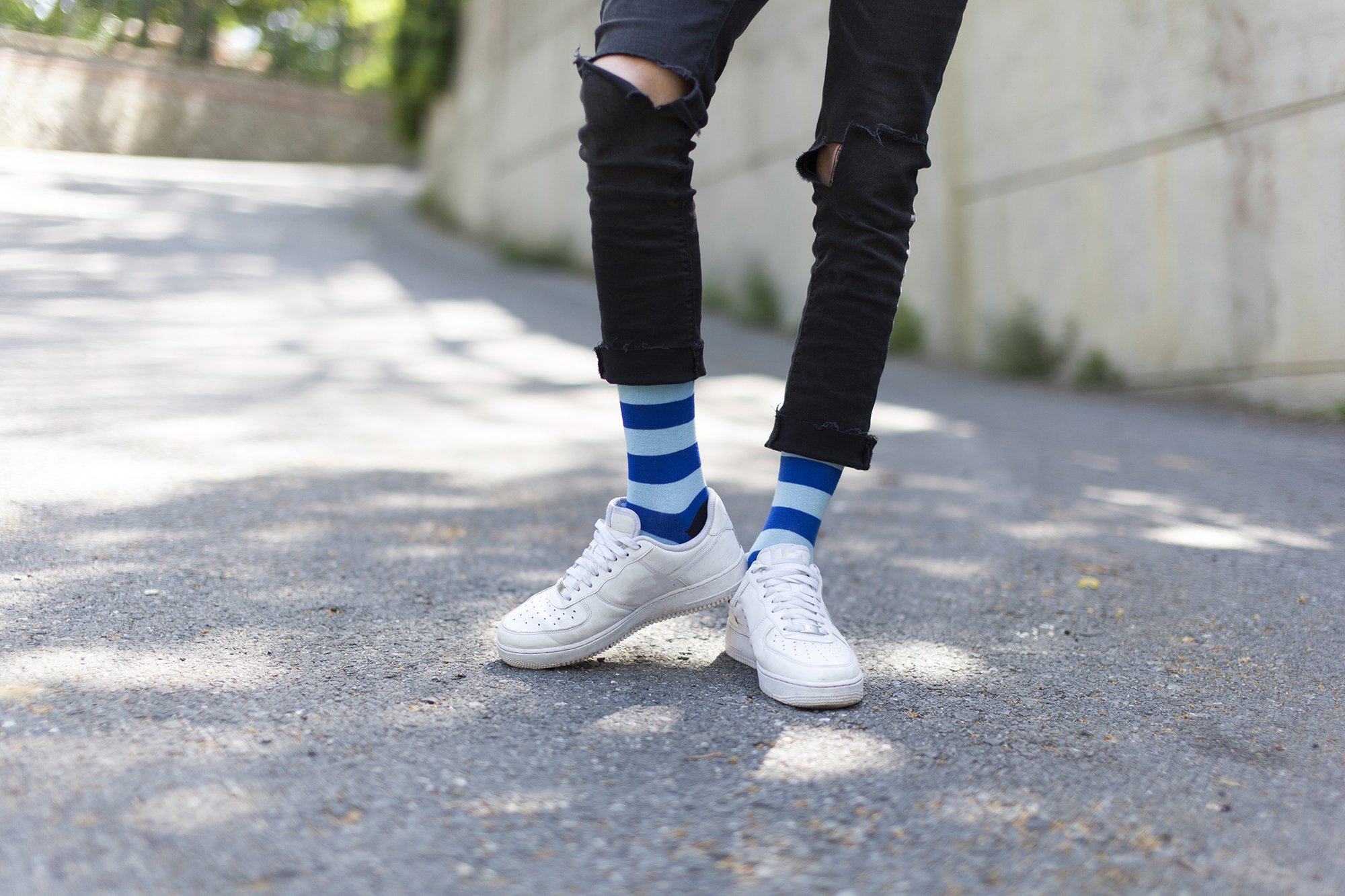 Men's sky blue stripe socks showcasing a vibrant design, perfect for adding a stylish touch to any outfit.