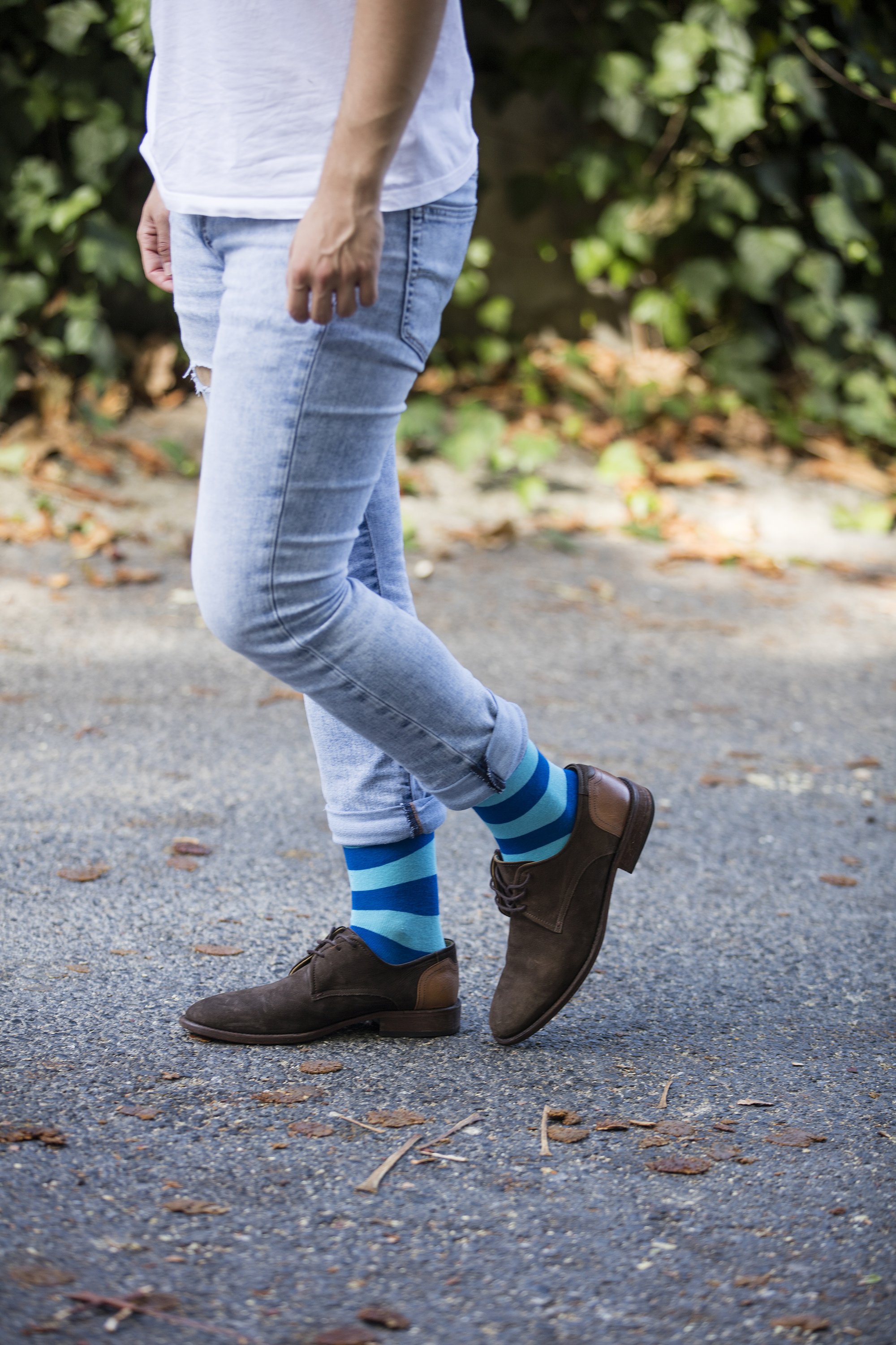 Men's sky blue stripe socks showcasing a vibrant design, perfect for adding a stylish touch to any outfit.