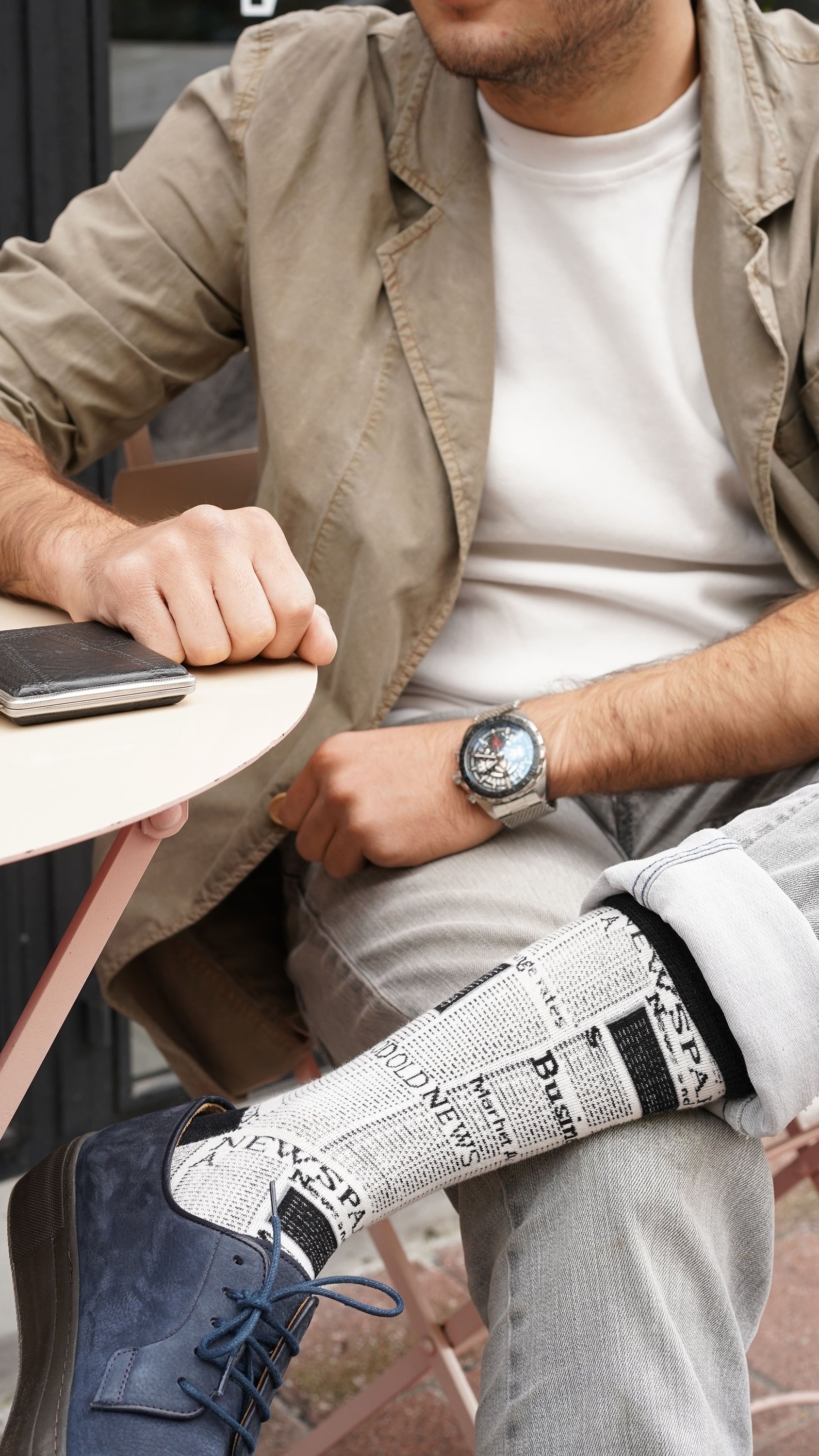 A collection of vibrant and stylish Men's Super Cool Socks displayed in a luxurious gift box, showcasing their trendy patterns and colors.