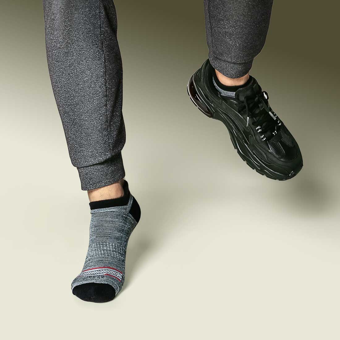 Dark gray Merino wool no show socks with blister tab, designed for comfort and protection.