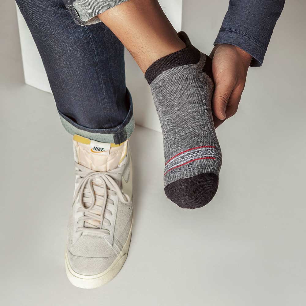 Dark gray Merino wool no show socks with blister tab, designed for comfort and protection.