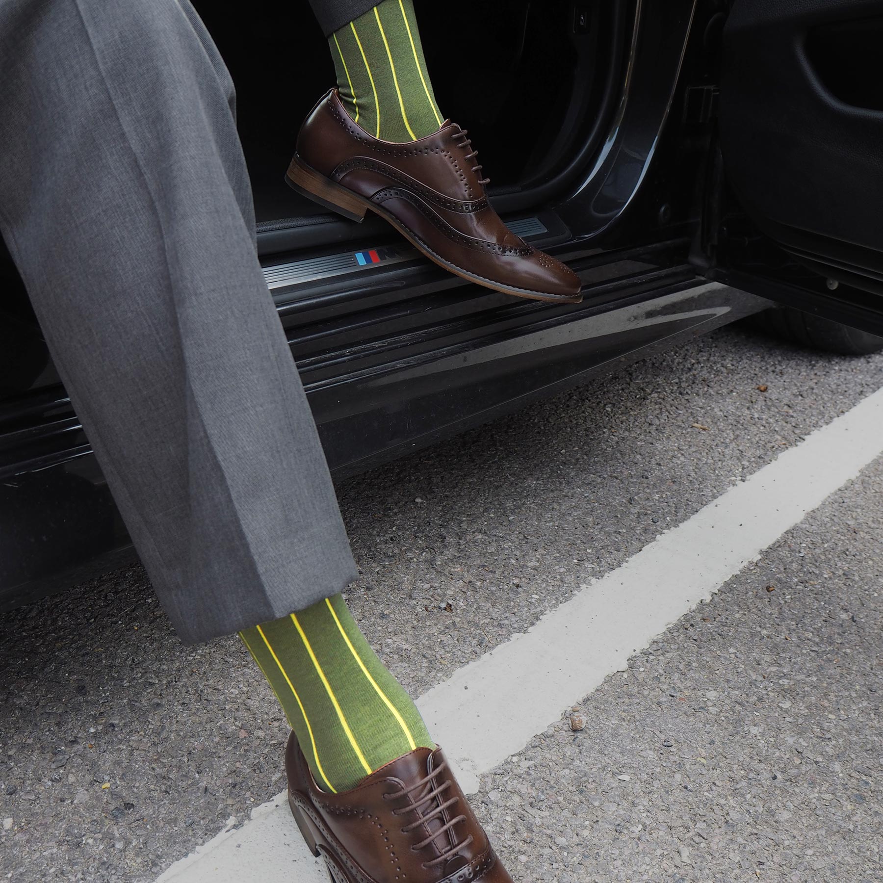 Green Pin Stripe men's socks with contrasting yellow stripes, heel, and toe, showcasing luxury and comfort.