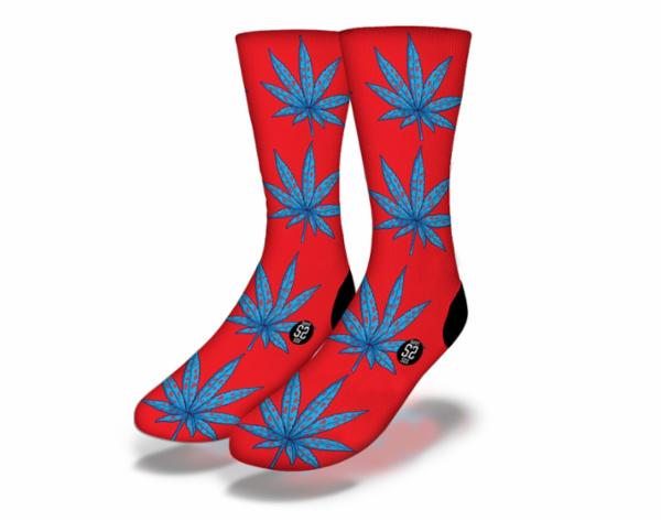 Vibrant red and blue socks featuring a pot leaf design, perfect for cannabis enthusiasts and fun sock lovers.