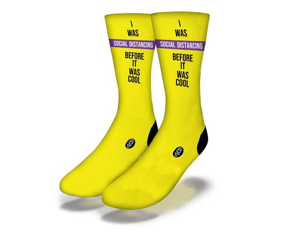 Bright yellow SOCIAL DISTANCING Funny Coronavirus Quarantine Socks featuring humorous designs, perfect for introverts and homebodies.