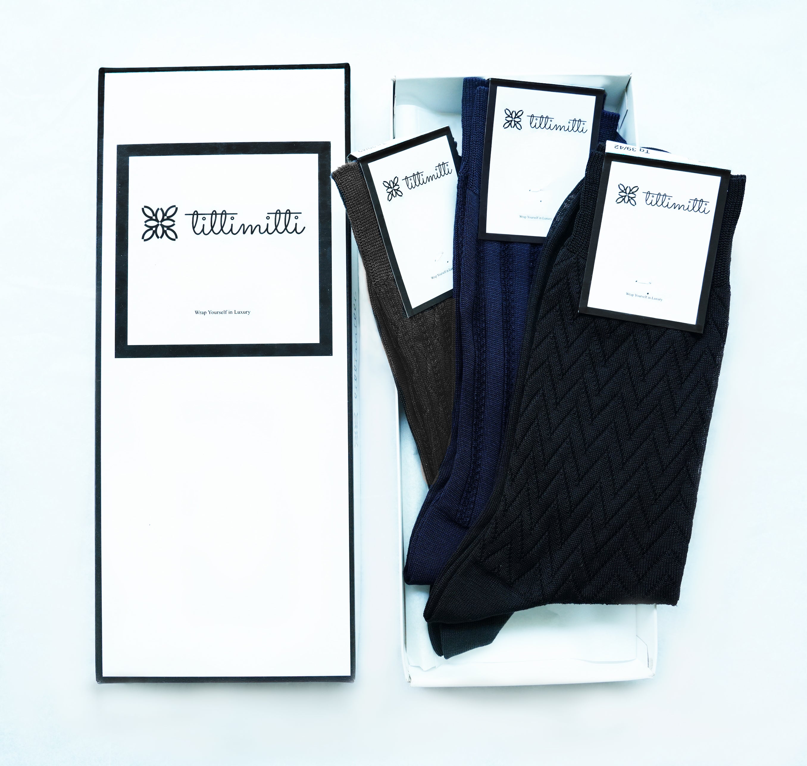 A pair of tittimitti® 100% Mercerized 'Filo di Scozia' Cotton Men's Dress Socks, showcasing their luxurious texture and elegant design, perfect for any occasion.