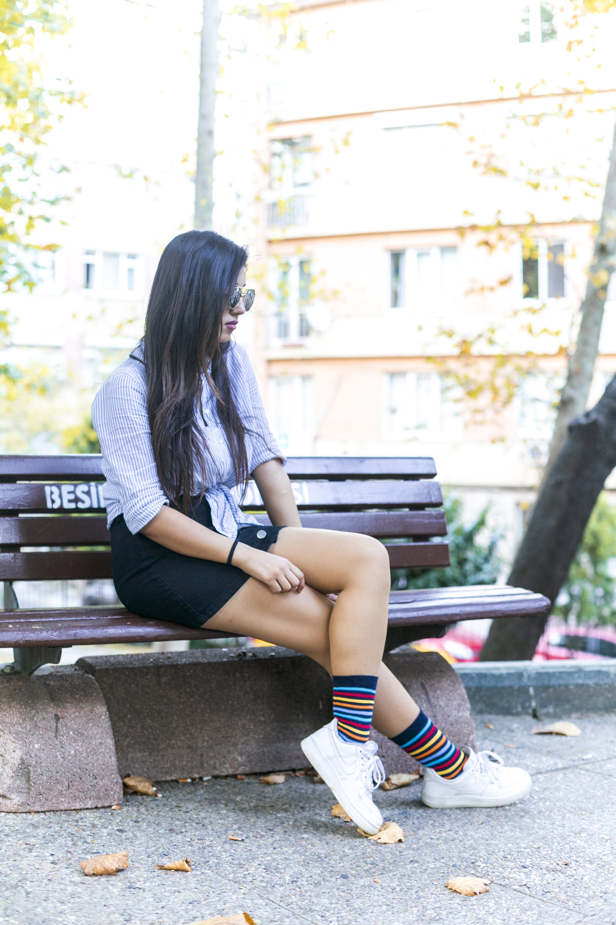A pair of Women's Black Rainbow Stripe Socks featuring vibrant rainbow stripes on a black background, showcasing comfort and style.