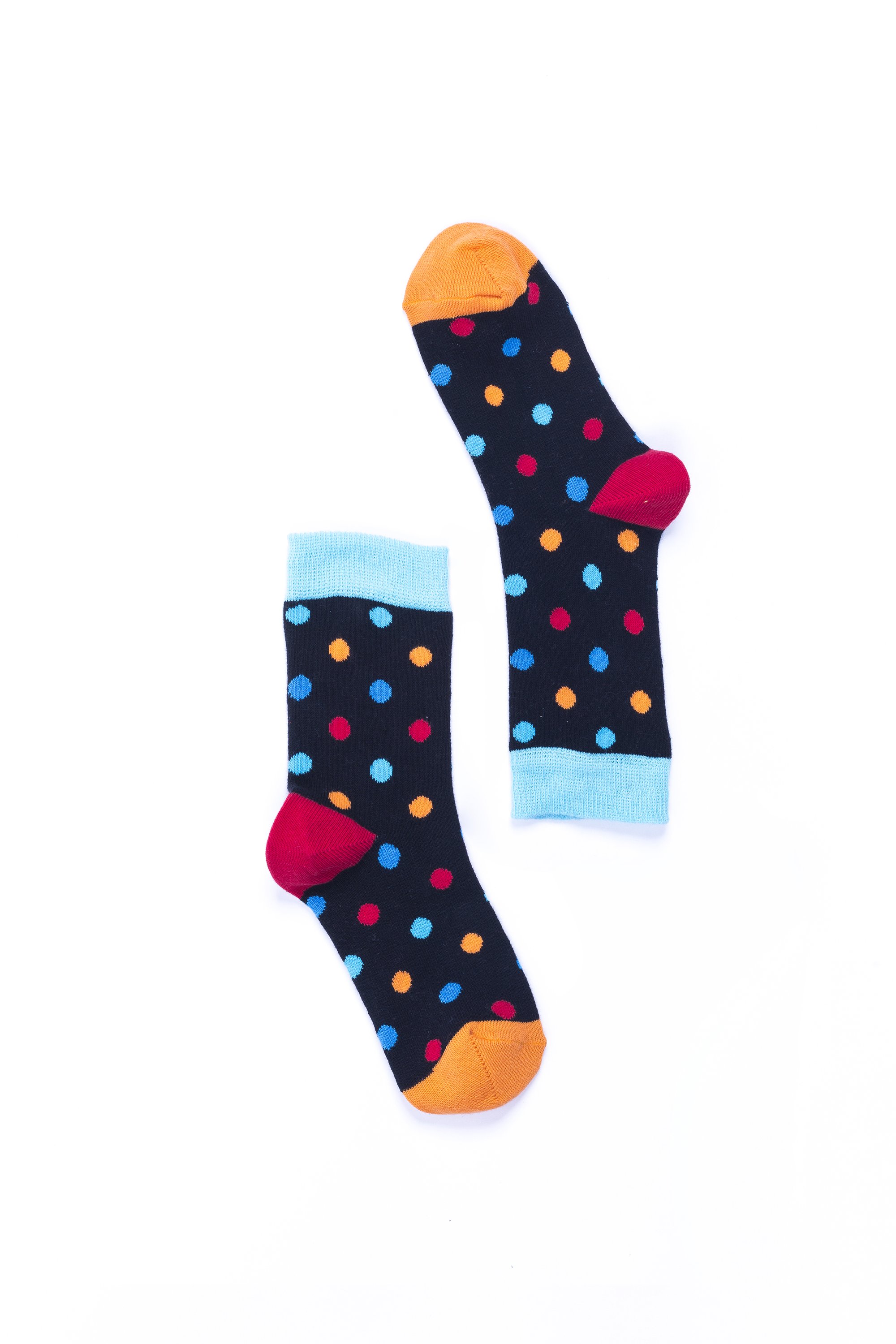 A pair of Women's Black Sky Dot Socks featuring a vibrant black and colorful dot pattern, made from soft Turkish cotton for comfort.
