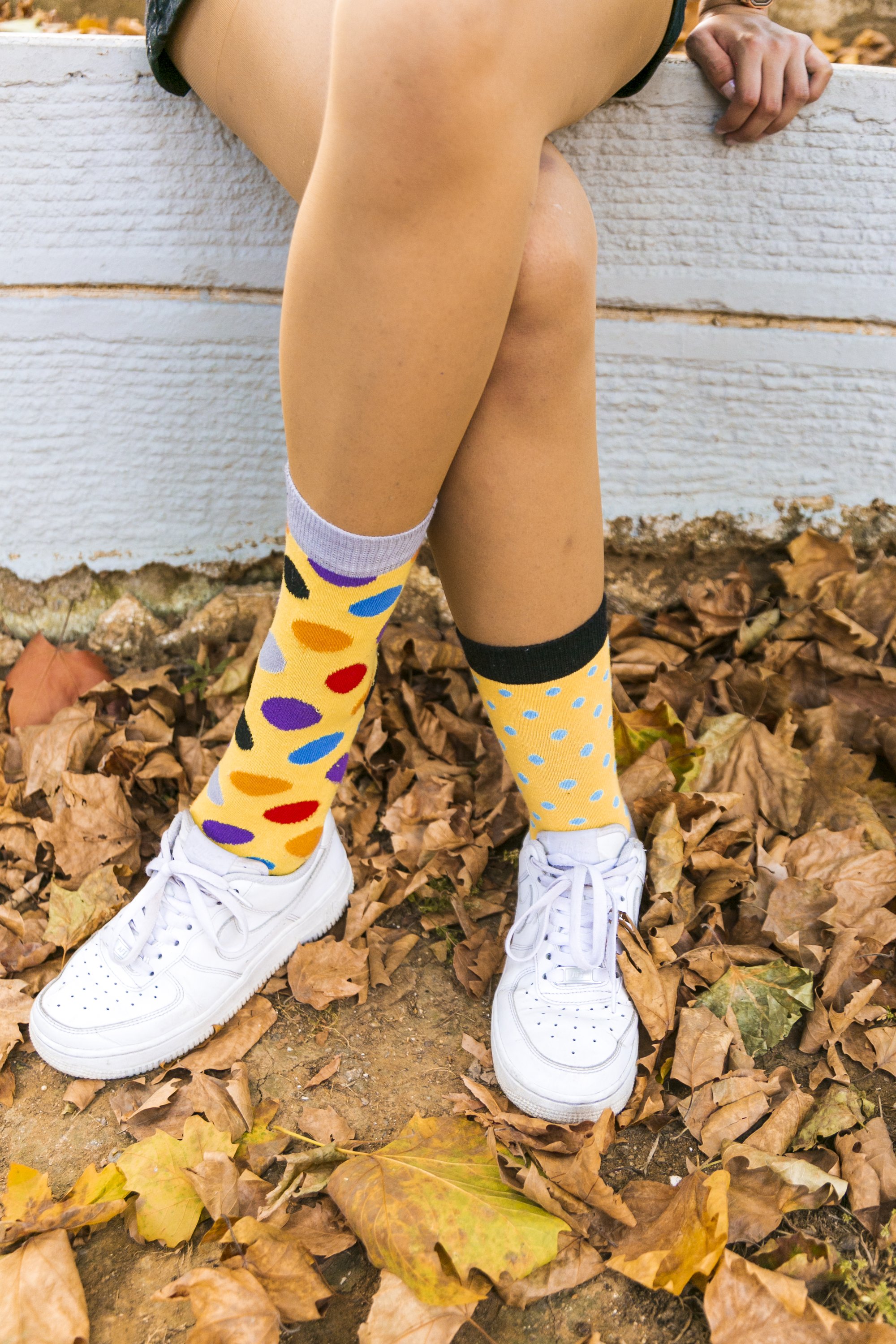 A pair of stylish Women's Blonde Dot Socks featuring a colorful dot pattern, made from premium cotton for comfort and durability.