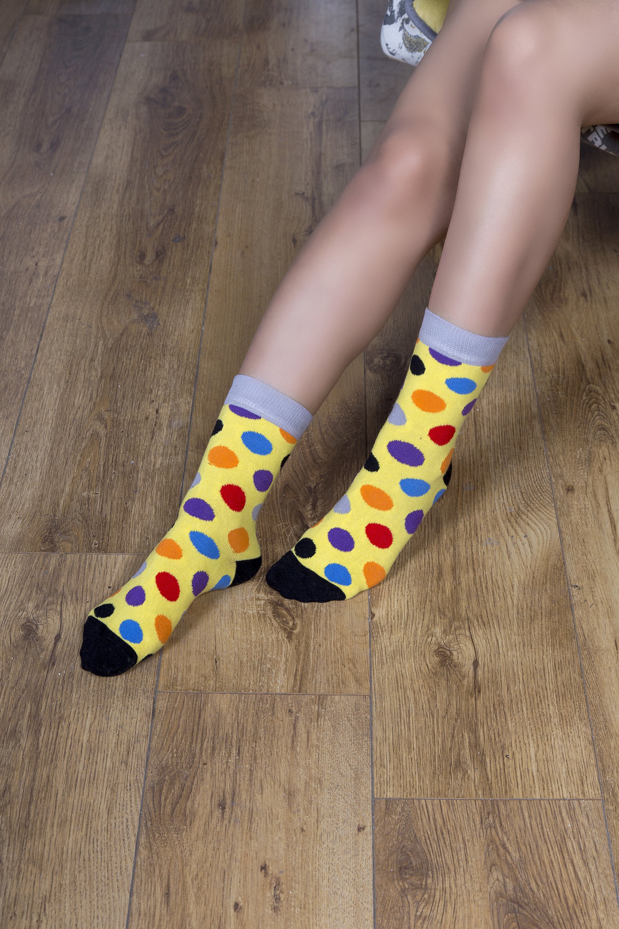 A pair of stylish Women's Blonde Dot Socks featuring a colorful dot pattern, made from premium cotton for comfort and durability.